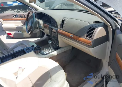 2000 Lincoln Continental z USA, uszkodzony, nr VIN 1LNHM97V0YY840446